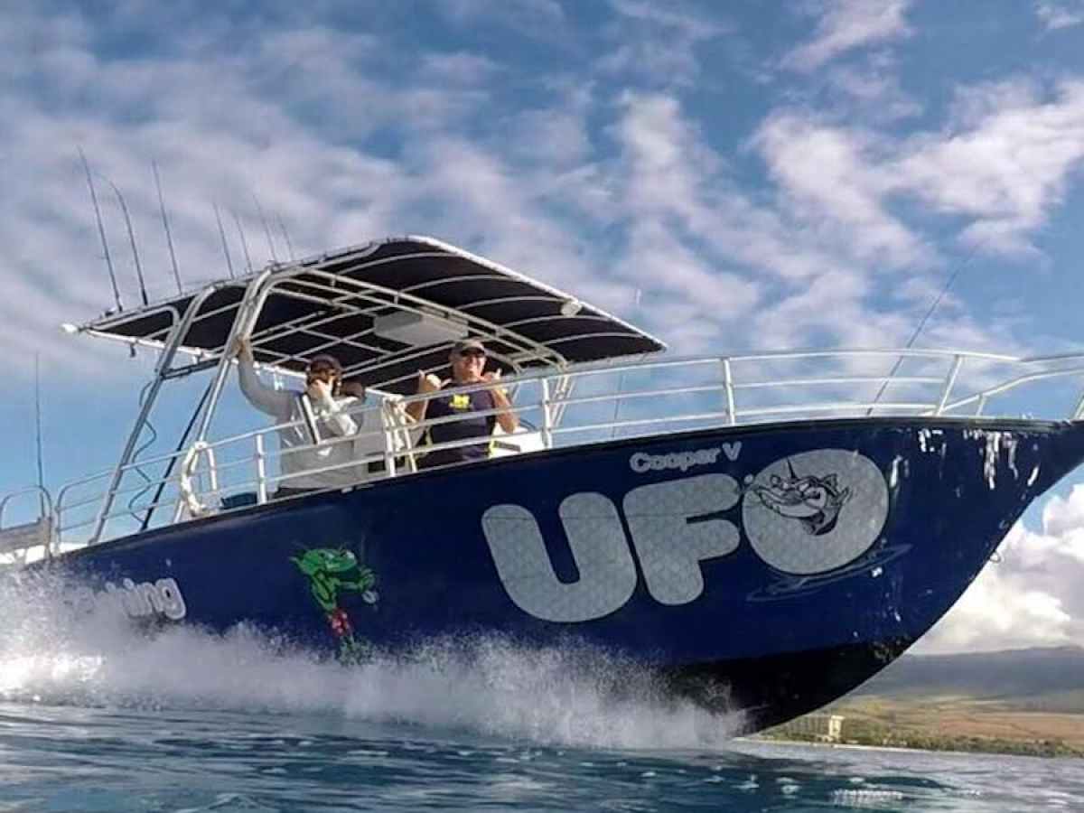 a close up of a boat next to a body of water