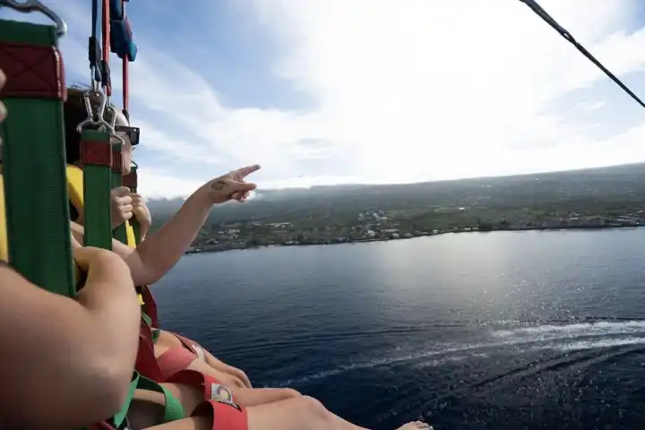 a woman standing next to a body of water