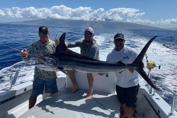 a group of people on a boat in the water