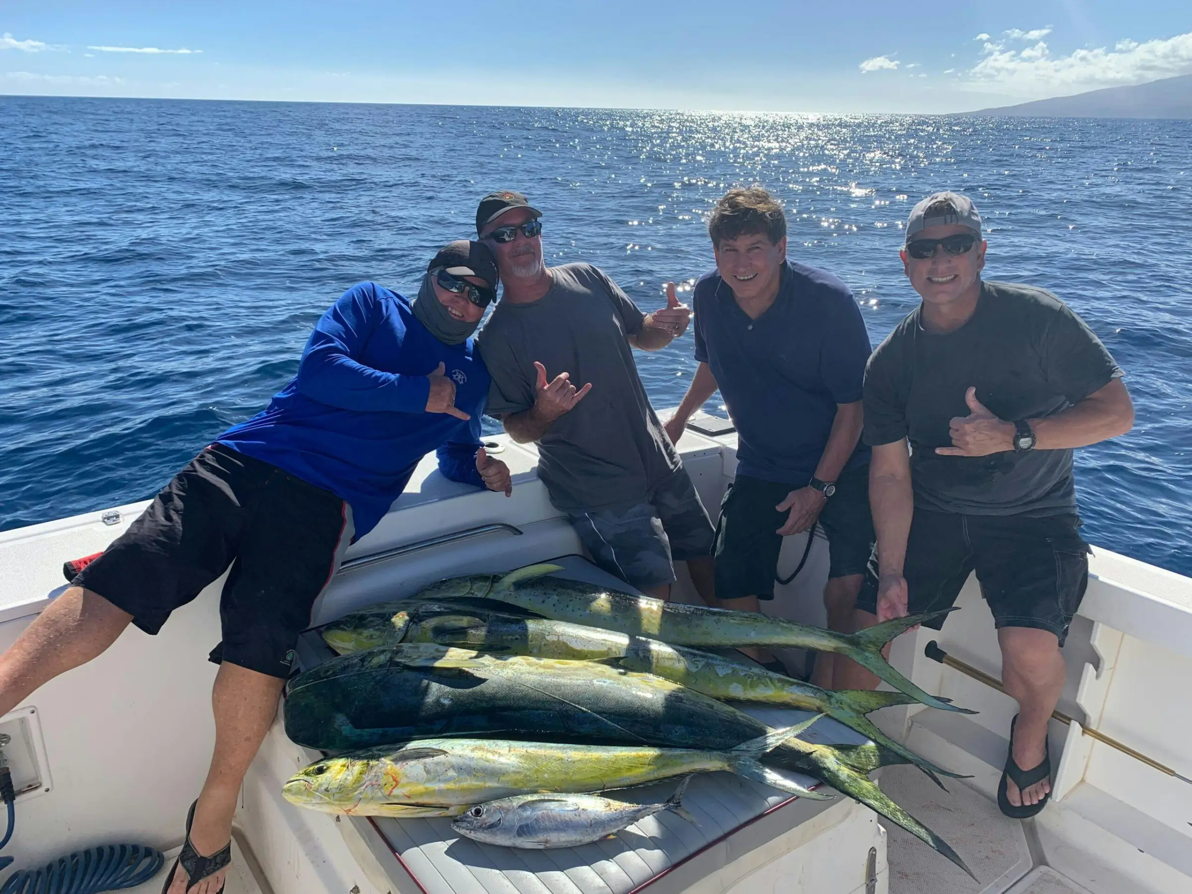 a couple of people that are standing in the water