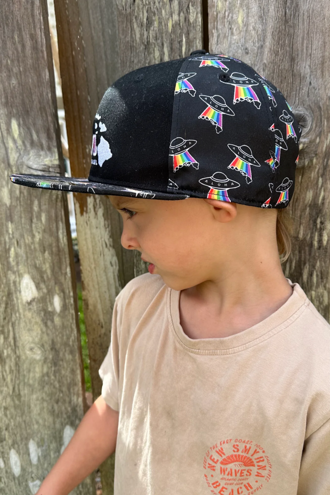 a little boy wearing a hat