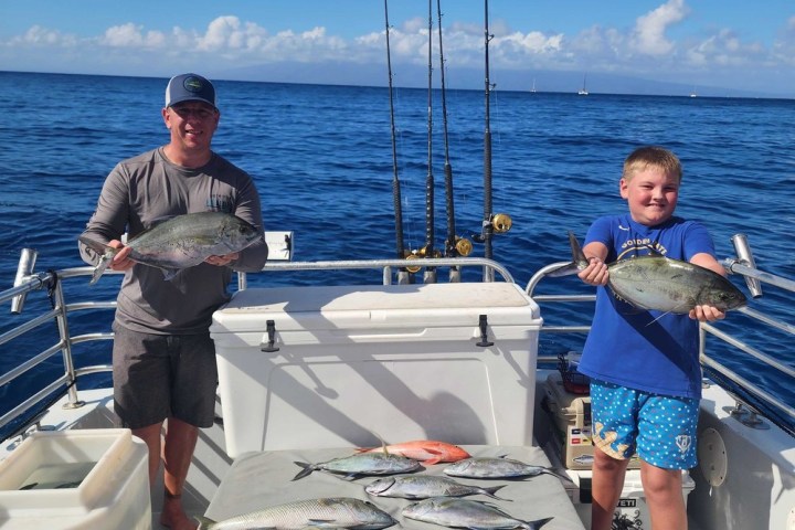a group of people in a boat on a body of water