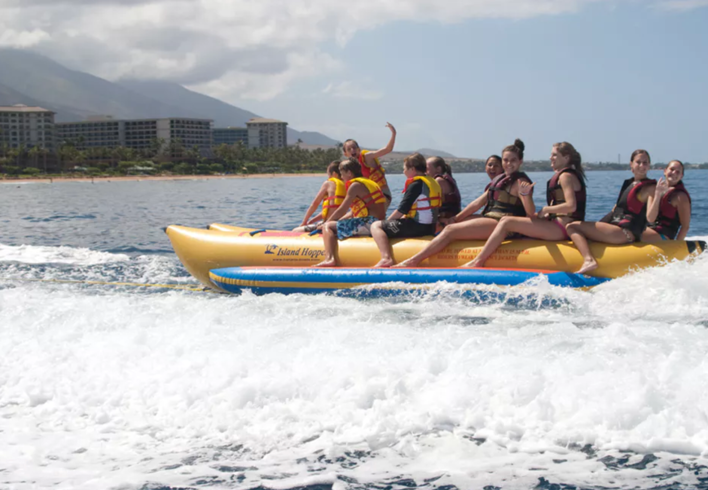 a group of people on a boat in the water