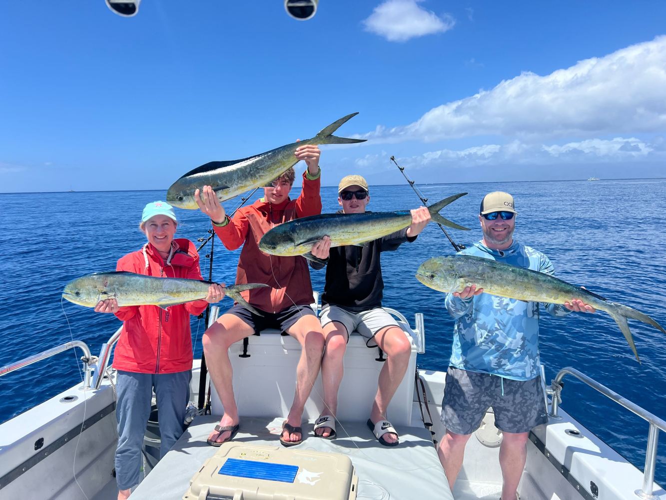 a group of people standing on a boat